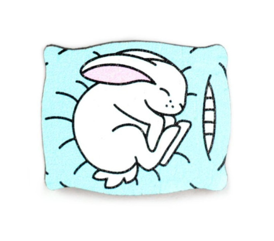 Значок Кролик на подушке